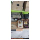 Chevy hub cap, volt tester, speaker , phone ,