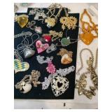 Group of mostly heart-shaped necklaces