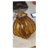 Vintage swag amber colored glass globe lamp.