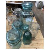 Green and clear ball mason jars and an insulator