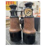 Old leather bound binoculars inscribed WAR OFFICE