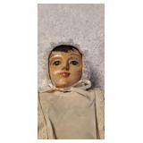 Very antique doll. Appears to be carved out of