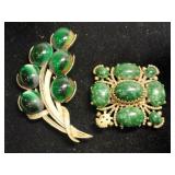2  vintage brooches gold tone with green stones