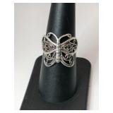 Silver butterfly ring marked 925 size 7.    .075