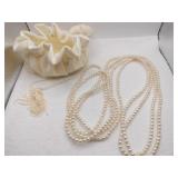 Long beaded necklace in jewelry pouch