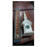 Wooden pharmacist sign and birdhouse