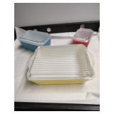 Group of three Pyrex stacking dishes.