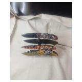 A Collection Of 4 Skull Themed Pocket