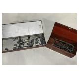 Various sockets and Alan wrenches in two metal