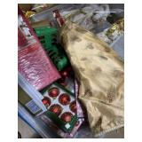 Christmas tote full of ornaments, standing tree