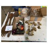 large, wooden serving utensils, metal wall decor,