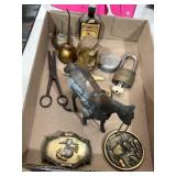 Belt buckles, unique figurines, oil cans, padlock