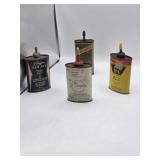 Remington, Higgins and other gun oil tins some