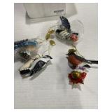 Four decorative bird ornaments