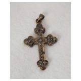 Silver gold tone cross marked 925.     .105oz