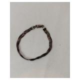 Silver braided bracelet marked 925.   .140oz