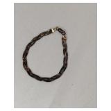 Silver braided bracelet marked 925.   .140oz