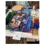 Mix of toys, some unopened, wooden plane, drum,