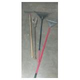 Rakes , and post hole digger
