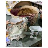 Two decorative vases and two fancy hats and hat