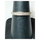 Gold clear Stone band ring marked 10K size 6.5.