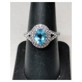 Silver light blue stone ring marked 925 sun