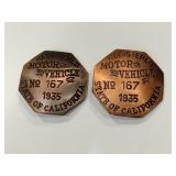 Two motor vehicle badges