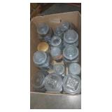 Canister jars with assortment of screws and nails