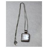 silver mother of pearl charm marked Mexico 925.