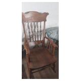 Wooden rocking chair with arms