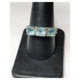 Silver blue  topaz ring marked 925 size 9.
