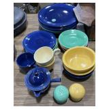 Mix of fiesta ware and shakers, some have chips