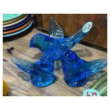 Blue glass bird paper weights