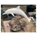 John Perry dolphin sculpture on a burlwood base