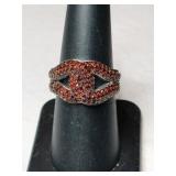 Silver garnet ring marked  STS karis  size 7.