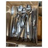 Mix of milkshakes spoons, servingware, butter