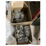 Two boxes of various size, mason jars, and lids