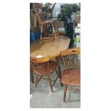 Oval laminate top dinning table with 4 matching