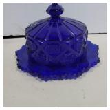 Blue glass covered butter dish