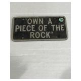 'Own a piece of the rock' sign