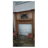 Fireplace mantle with brass bench inside with
