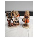 Pair of Hummel child figurines.