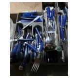 Blue handled flatware marked Mexico in tray
