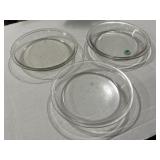 3 pyrex pie pans, one has a chip