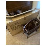 Wooden magazine rack and glass and metal wall