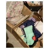 Two boxes of various fabrics