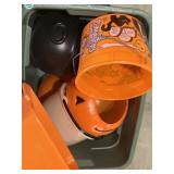 Tote of plastic Halloween candy buckets