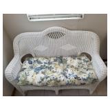 White Wicker Loveseat with Floral Seat Cushion