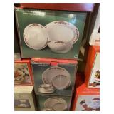 Three sets of poinsettia and ribbons dinnerware