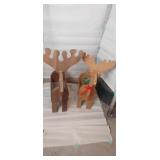 2 wooden reindeer decorations
